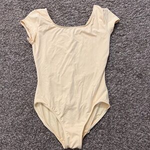 Light yellow women’s leotard/bodysuit